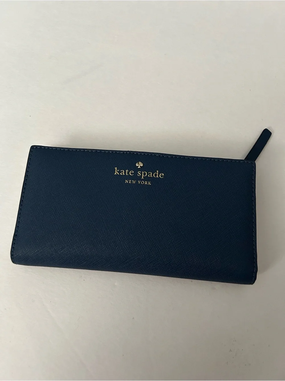 Kate Spade navy blue zip wallet with gold logo